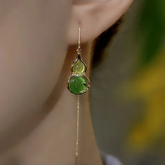 Close-up detail of the sparkling zircons and plating on the Green Gourd Threader Earrings