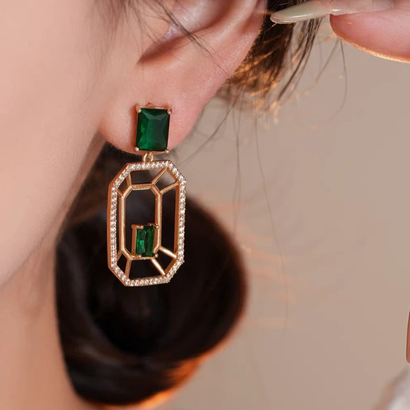 Close-up detail of the sparkling zircons and plating on the Green Rectangular Earrings