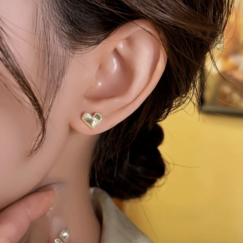 Close-up detail of the sparkling zircons and plating on the Gold Heart Studs