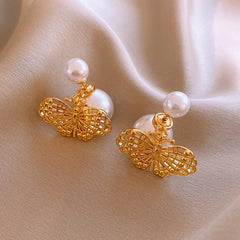 Angled view of the 14K Gold-Plated Elegant Hollow Butterfly Pearl Earrings