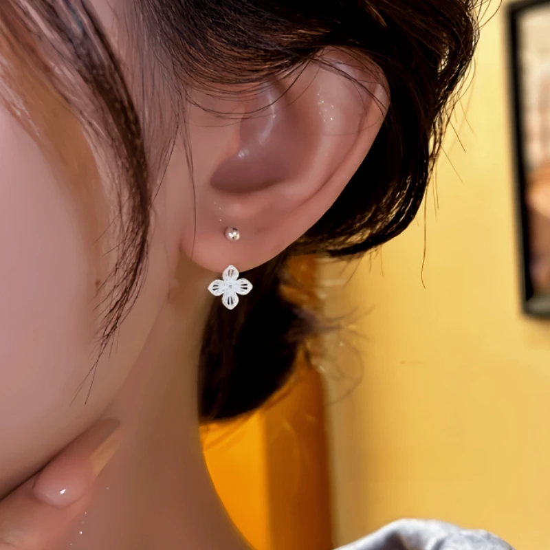 Close-up detail of the sparkling zircons and plating on the Flower Jacket Earrings