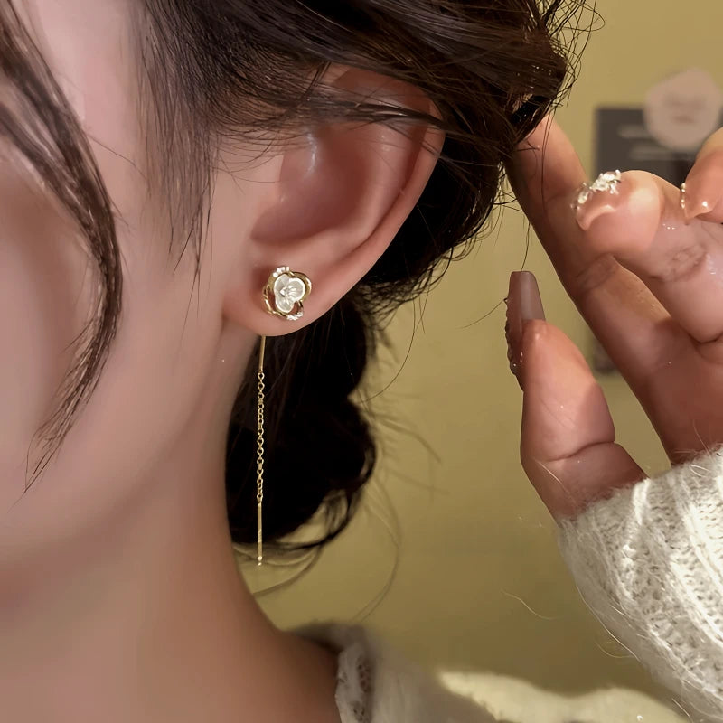 Close-up detail of the sparkling zircons and plating on the Flower Threader Earrings