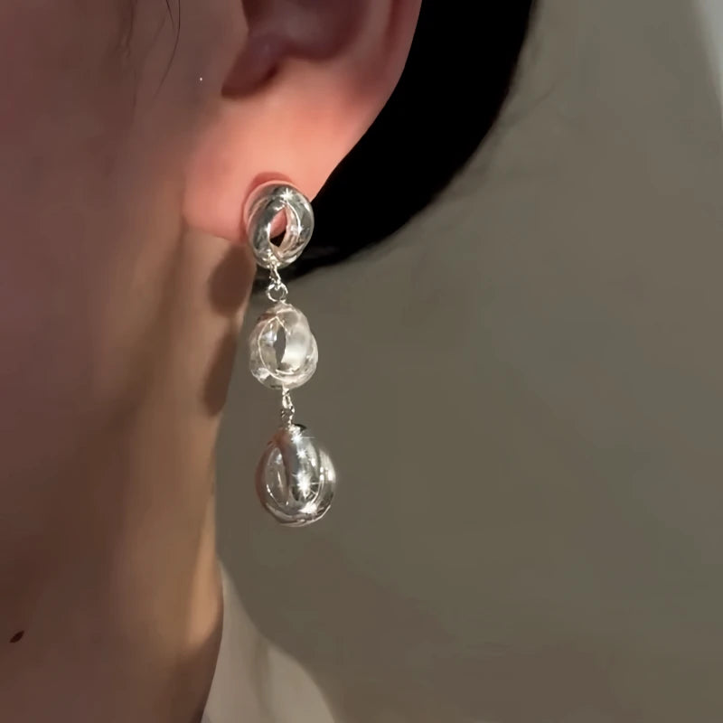 Close-up detail of the sparkling zircons and plating on the Layered Water Drop Earrings