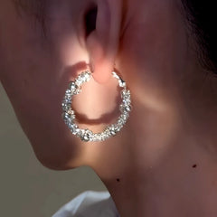 Close-up detail of the sparkling zircons and plating on the White Gold Hoop Earrings