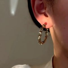 Close-up detail of the sparkling zircons and plating on the Silver Hoop Earrings