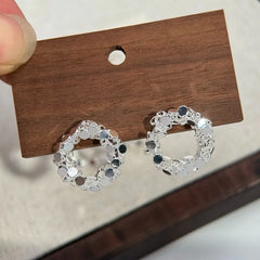 Angled view of the 14K Gold-Plated Elegant Hoop Stud Earrings