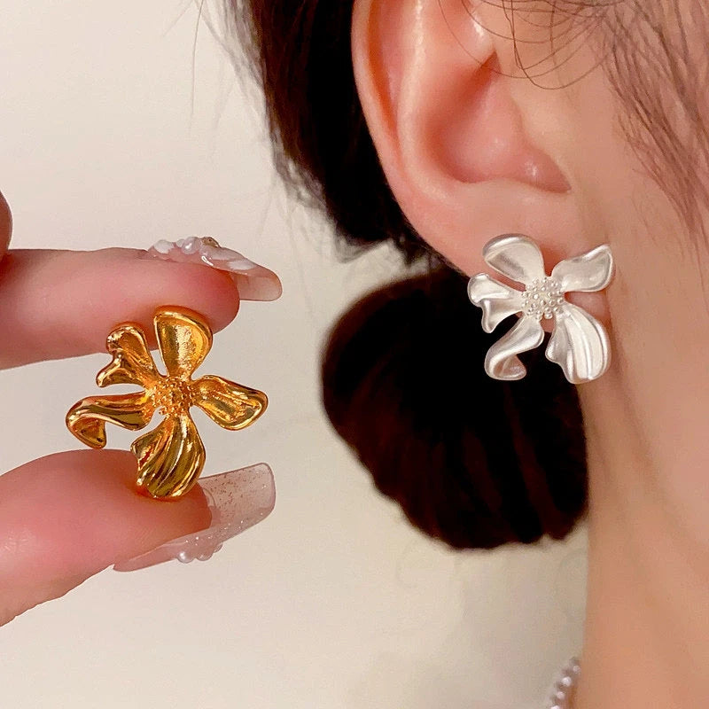 Close-up detail of the sparkling zircons and plating on the Flower Stud Earrings