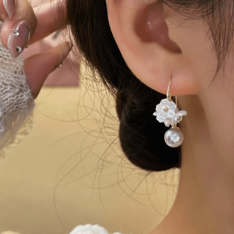 Close-up detail of the sparkling zircons and plating on the Jasmine Flower Earrings