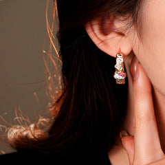 Model showcasing the dangle and style of the 14K Gold-Plated Elegant Kitten C-Shaped Earrings