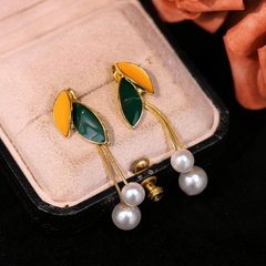 Close-up detail of the sparkling zircons and plating on the Leaf Pearl Tassel Earrings