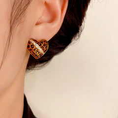 Close-up detail of the sparkling zircons and plating on the Leopard Heart Studs