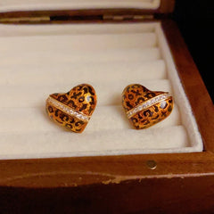 Angled view of the 14K Gold-Plated Elegant Leopard Heart Stud Earrings