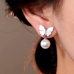 Close-up detail of the sparkling zircons and plating on the Mother of Pearl Butterfly Earrings