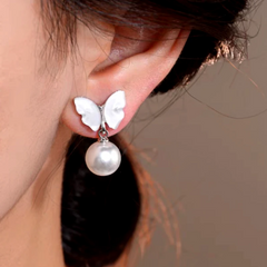 Angled view of the 14K Gold-Plated Elegant Mother-Of-Pearl Butterfly Earrings