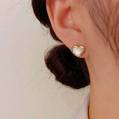 Angled view of the 14K Gold-Plated Elegant Mother-Of-Pearl Heart Earrings