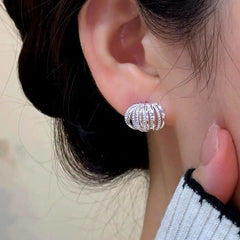 Close-up detail of the sparkling zircons and plating on the Multi-Layer Stud Earrings