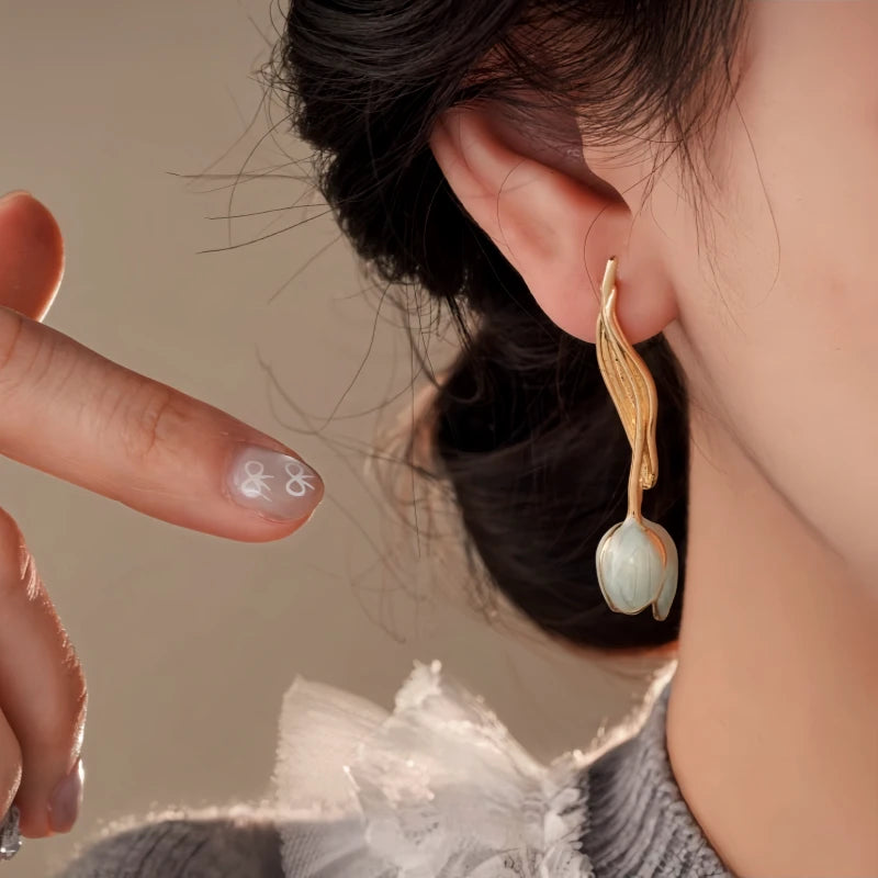 Close-up detail of the sparkling zircons and plating on the Tulip Earrings
