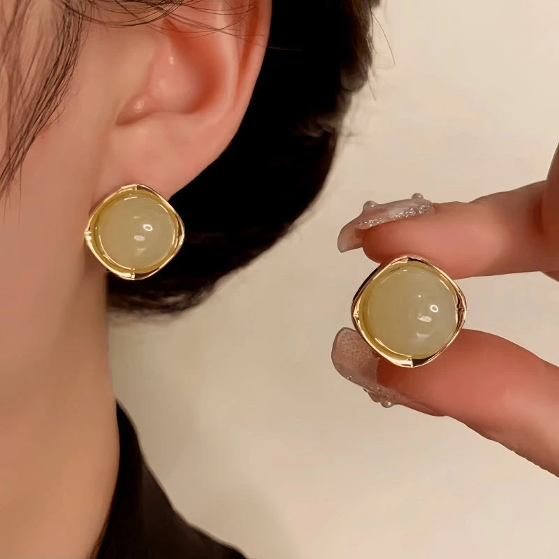 Close-up detail of the sparkling zircons and plating on the Geometric Stud Earrings