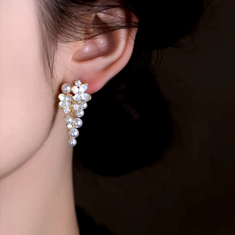 Close-up detail of the sparkling zircons and plating on the Flower Pearl Tassel Earrings