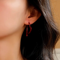 Close-up detail of the sparkling zircons and plating on the Heart Earrings