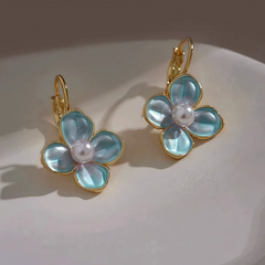 Close-up detail of the sparkling zircons and plating on the Blue Flower Earrings
