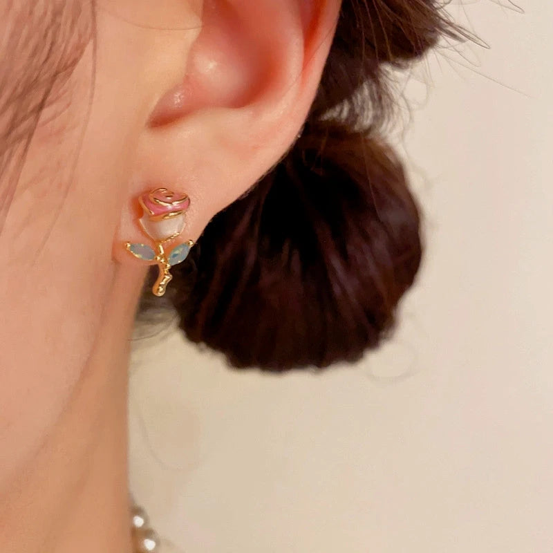 Close-up detail of the sparkling zircons and plating on the Rose Stud Earrings