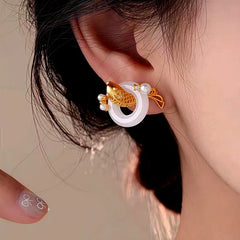 Close-up detail of the sparkling zircons and plating on the Peace Studs