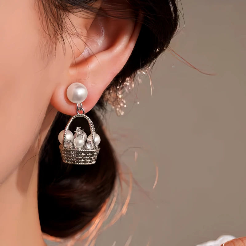 Close-up detail of the sparkling zircons and plating on the Pearl Basket Earrings