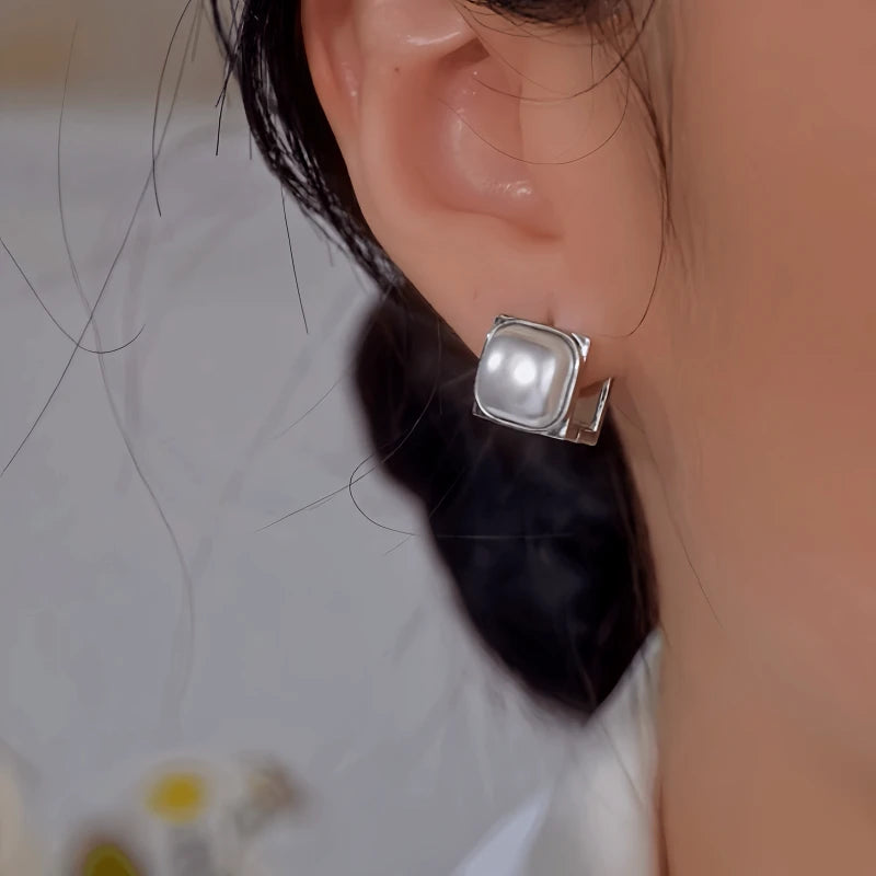 Close-up detail of the sparkling zircons and plating on the Double-Sided Pearl Earrings