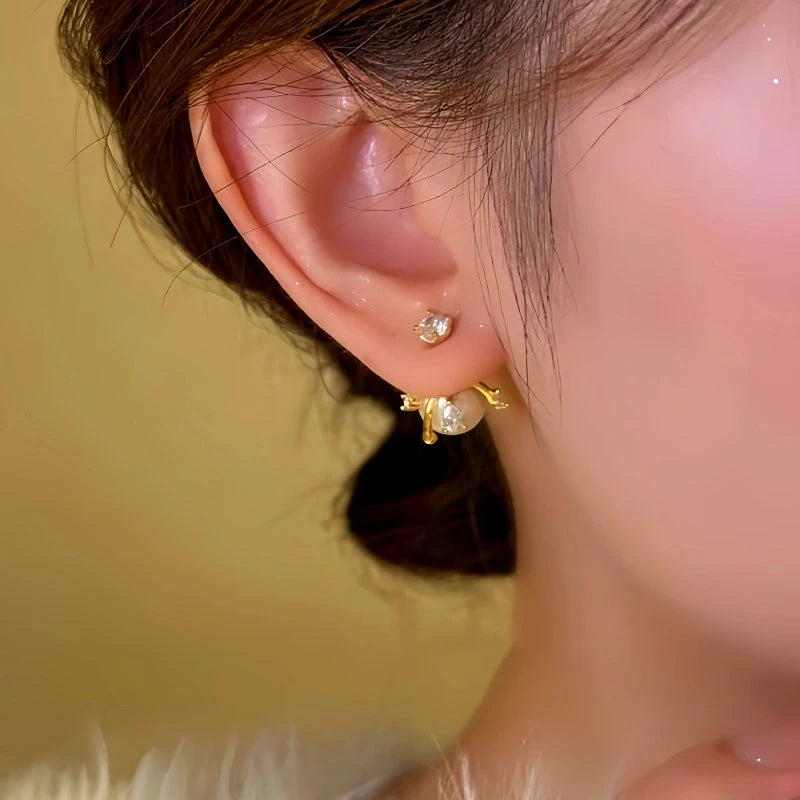 Close-up detail of the sparkling zircons and plating on the Pearl Earrings