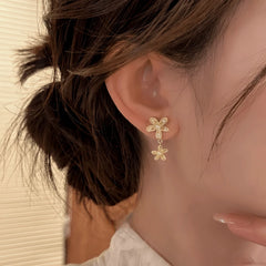 Close-up detail of the sparkling zircons and plating on the Pearl Flower Earrings