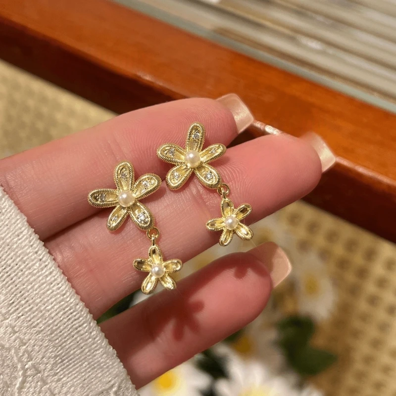 Angled view of the 14K Gold-Plated Elegant Pearl Flower Earrings