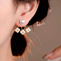 Model showcasing the dangle and style of the 14K Gold-Plated Elegant Pearl Flower Pearl Jacket Earrings