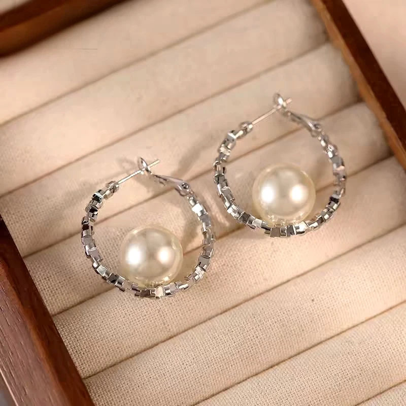 Angled view of the 14K Gold-Plated Elegant Pearl Hoop Earrings