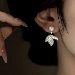 Close-up detail of the sparkling zircons and plating on the Petal Pearl Earrings