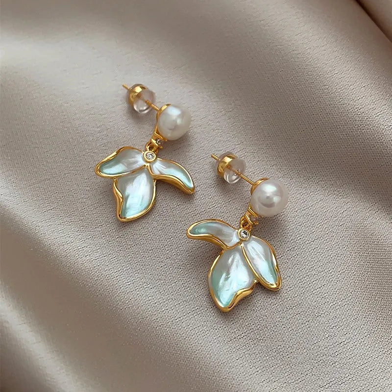 Angled view of the 14K Gold-Plated Elegant Petal Pearl Earrings