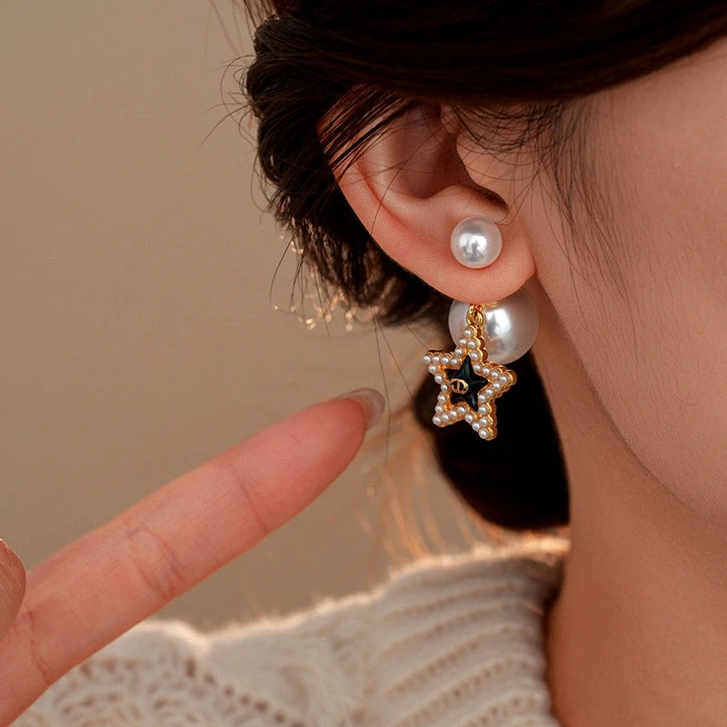 Close-up detail of the sparkling zircons and plating on the Star Pearl Earrings