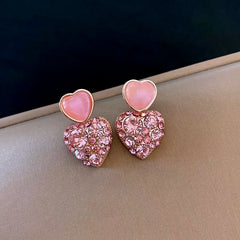 Angled view of the 14K Gold-Plated Elegant Pink Diamond Heart Earrings