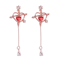 Angled view of the 14K Gold-Plated Elegant Pink Zircon Diamond Heart Tassel Earrings