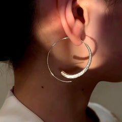 Close-up detail of the sparkling zircons and plating on the Plain Hoop Threader Earrings