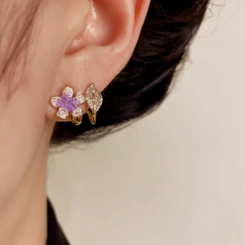 Close-up detail of the sparkling zircons and plating on the Purple Flower Studs