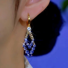 Close-up detail of the sparkling zircons and plating on the Purple Diamond Earrings