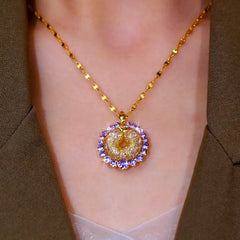 Close-up of the pendant and clasp on the Mesh Hoop Pendant Necklace