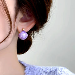 Close-up detail of the sparkling zircons and plating on the Purple Basket Earrings