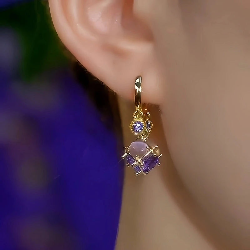 Close-up detail of the sparkling zircons and plating on the Purple Tassel Earrings