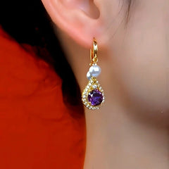 Close-up detail of the sparkling zircons and plating on the Purple Pearl Tassel Earrings