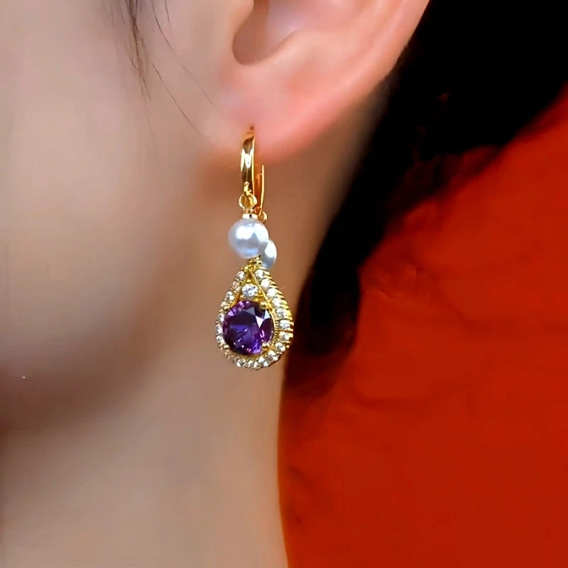 Model showcasing the dangle and style of the 14K Gold-Plated Elegant Purple Zircon Diamond Pearl Tassel Earrings