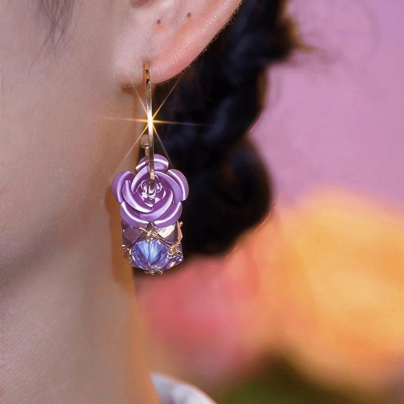 Close-up detail of the sparkling zircons and plating on the Purple Zircon Flower Earrings