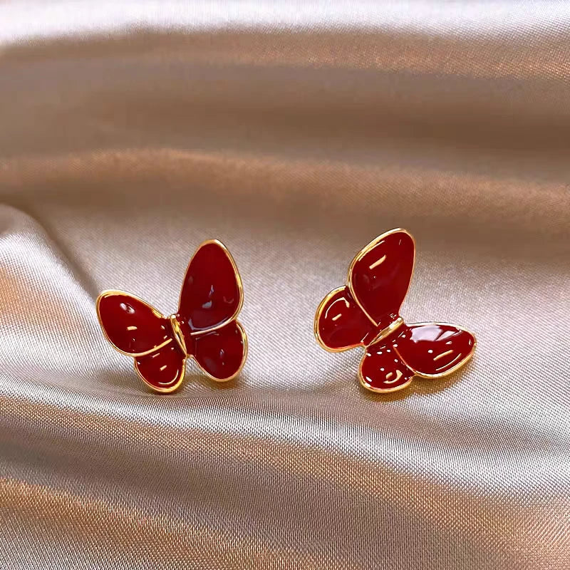 Angled view of the 14K Gold-Plated Elegant Red Butterfly Earrings