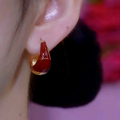 Close-up detail of the sparkling zircons and plating on the Red Oil Drop Earrings